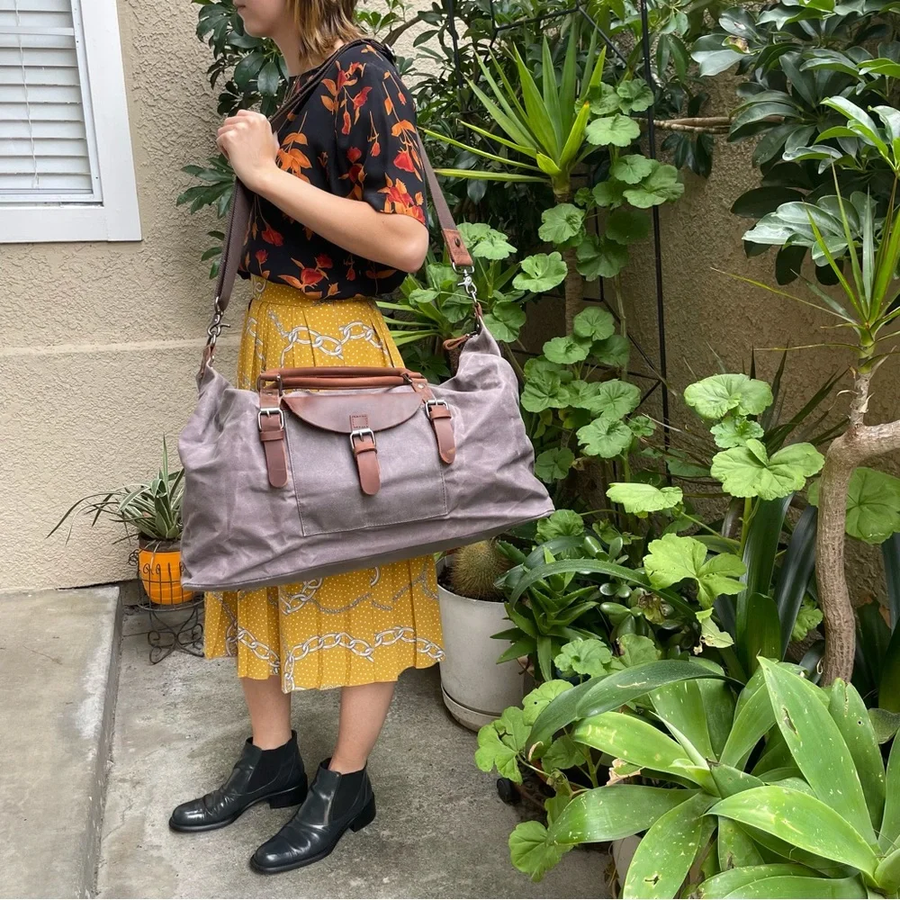 Grayish brown cotton/leather travel bag